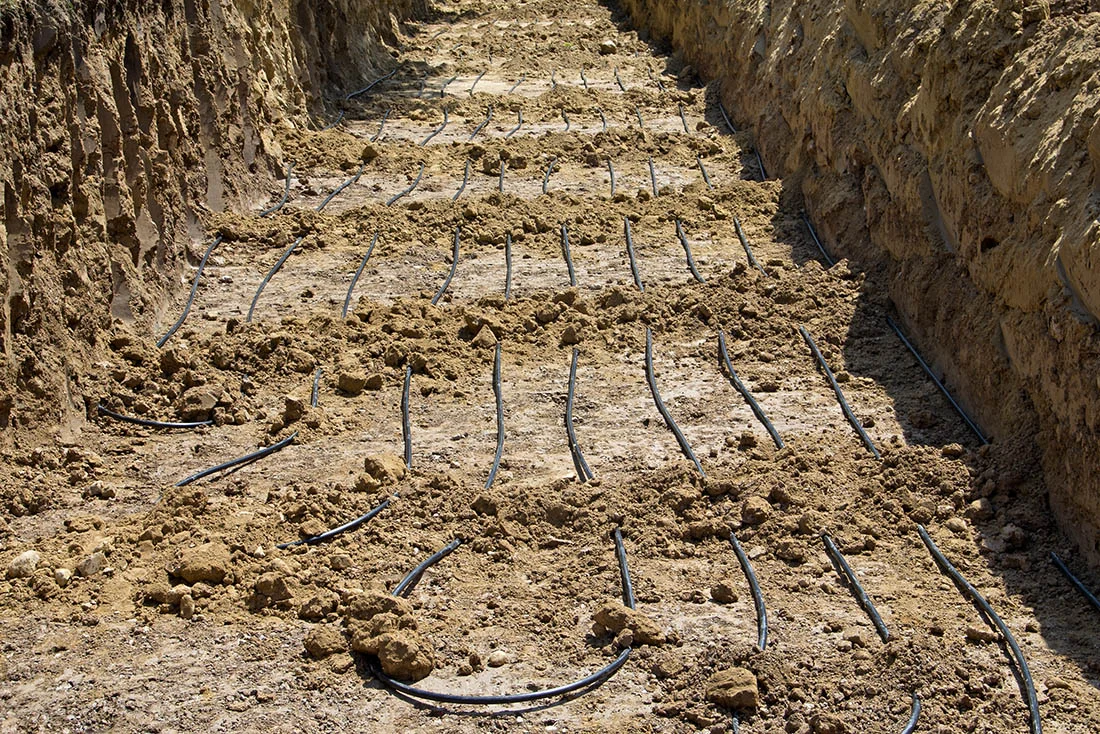 Geothermal Loops Geothermal loops in residential dirt trench for geothermal installation
