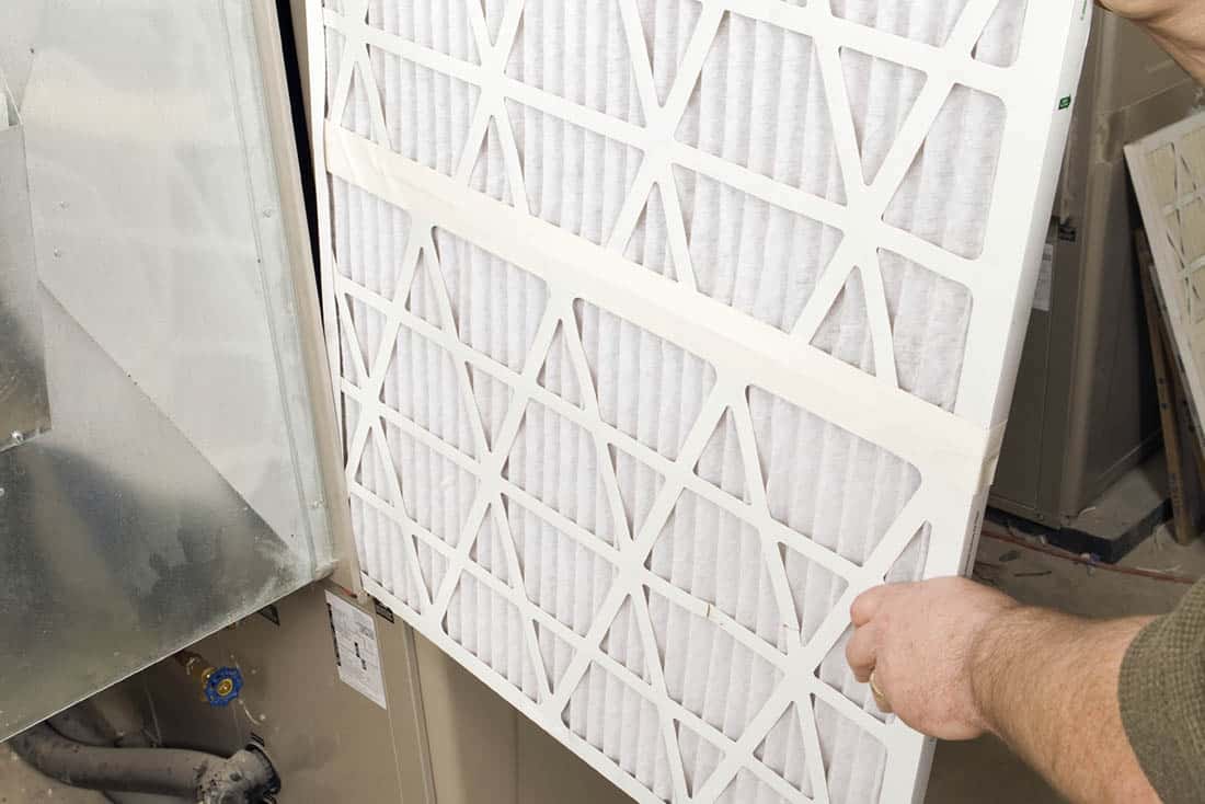heating-FurnaceMaintenance-Supporting-1100×734 Close-up of furnace filter near heating system